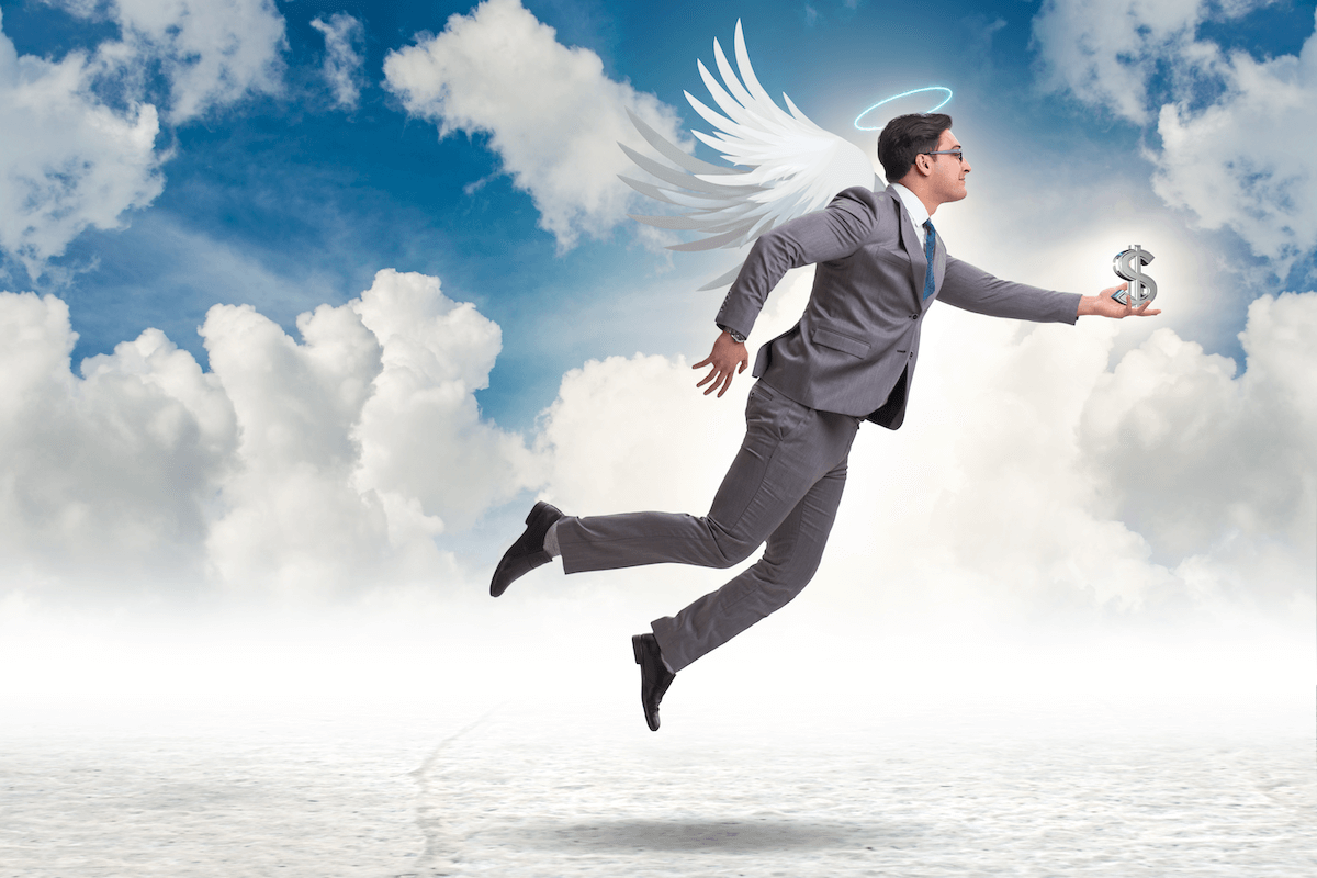 Angel investor depicted as a male angel in a suit.