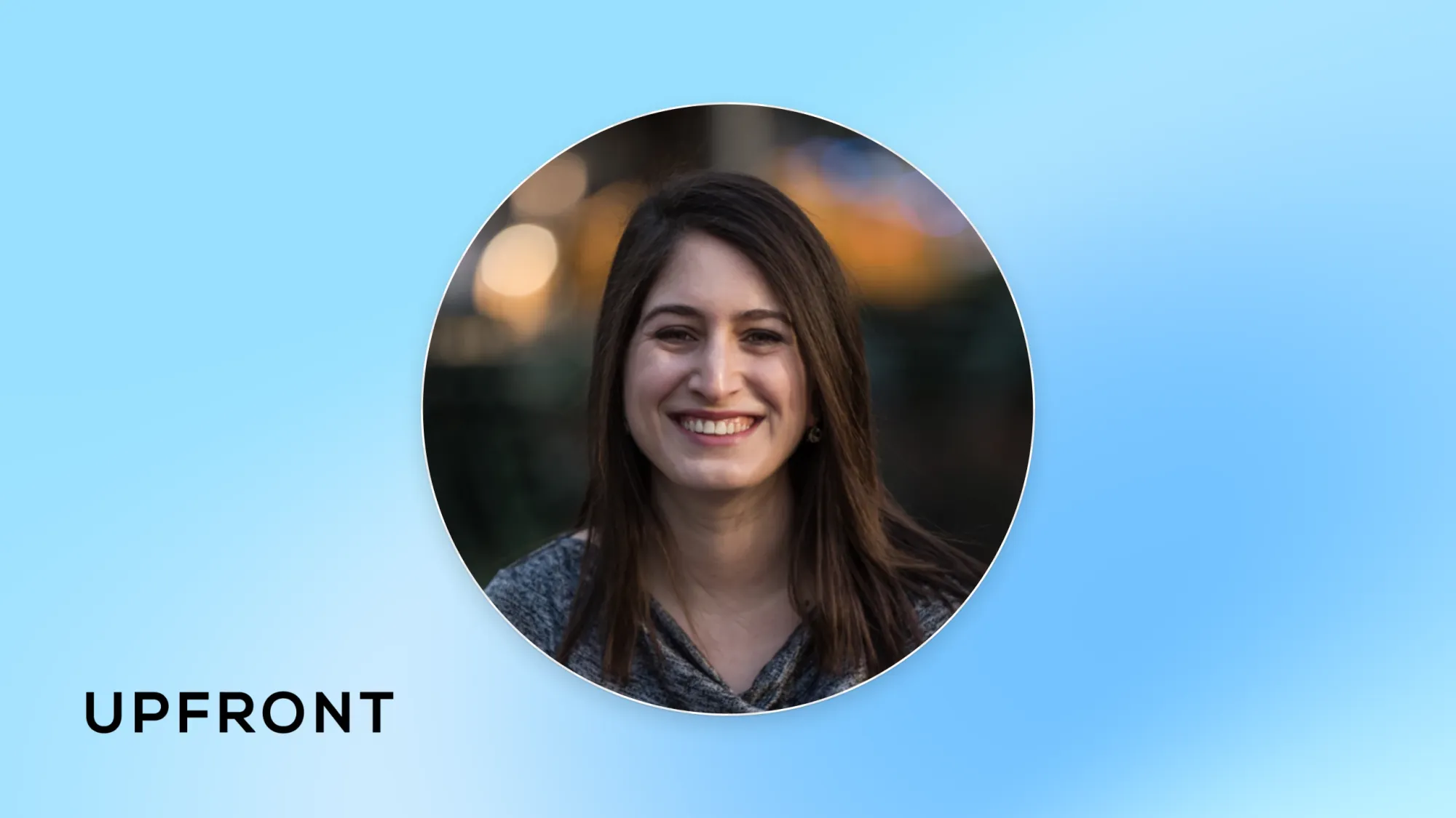 Smiling woman headshot in circular frame on blue background with UPFRONT text logo