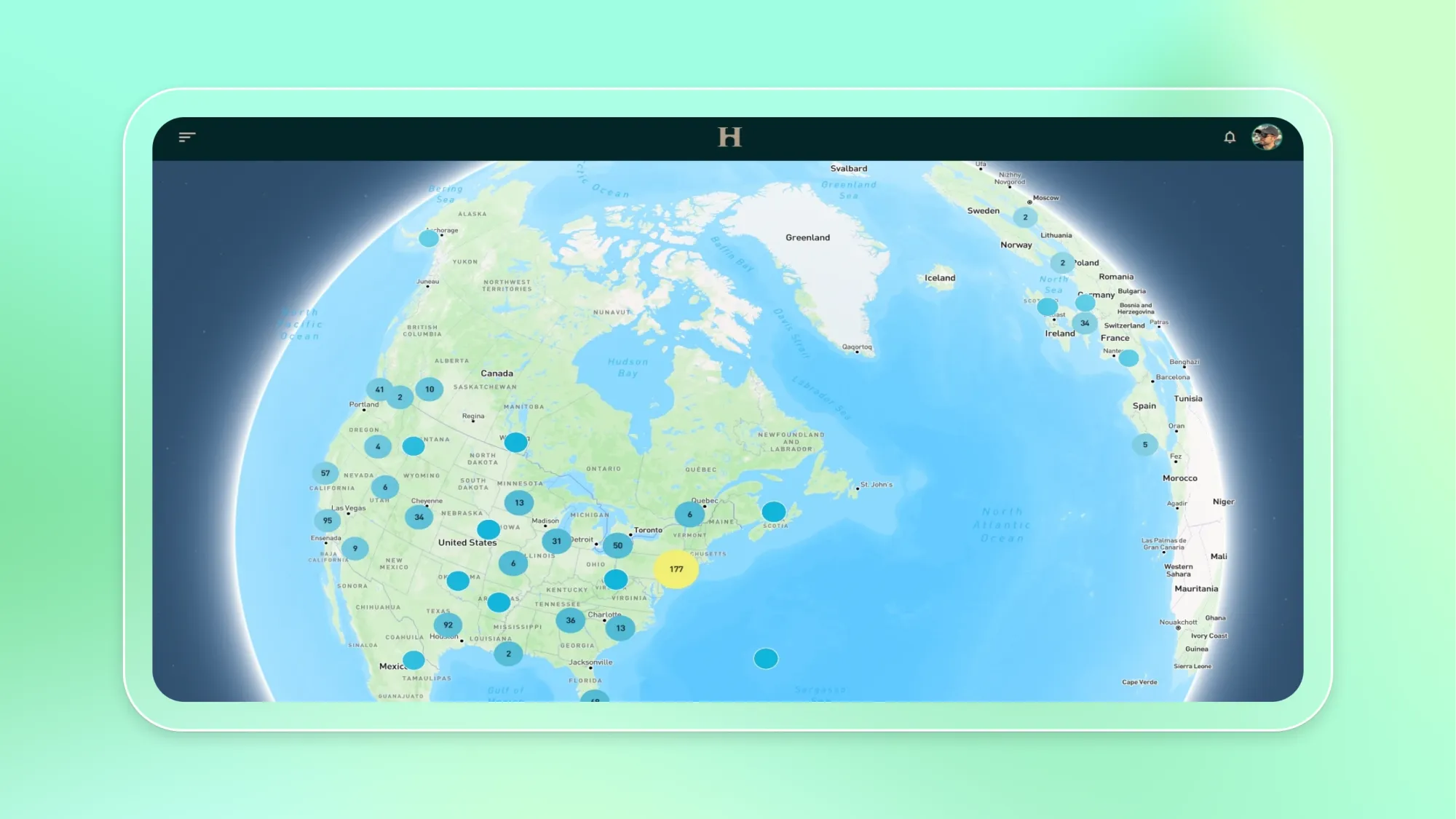 Tablet screen showing a world map dashboard with blue location cluster markers across the United States, Canada, and Europe and an H header icon