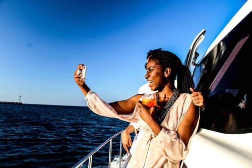 Nichole Bestman on boat taking a selfie.